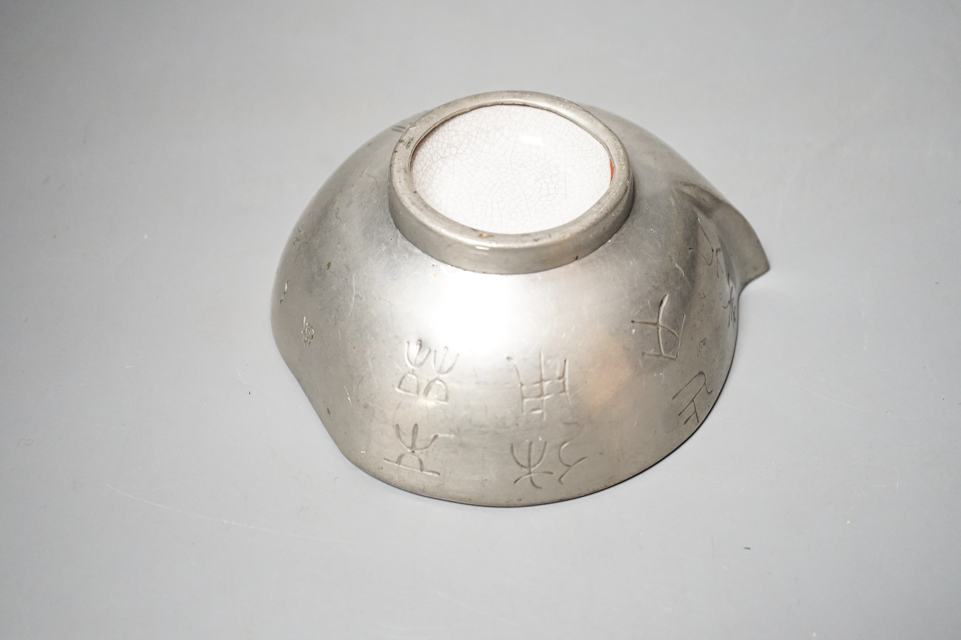 A Chinese Yixing pottery and pewter mounted peach shaped cup, late 19th century, length 13cm